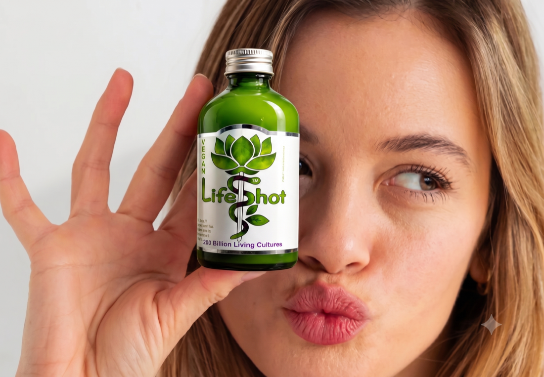 Woman holding a Rhythm Health Life Shot probiotic bottle